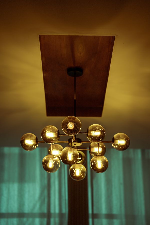 A modern chandelier with gold globes
