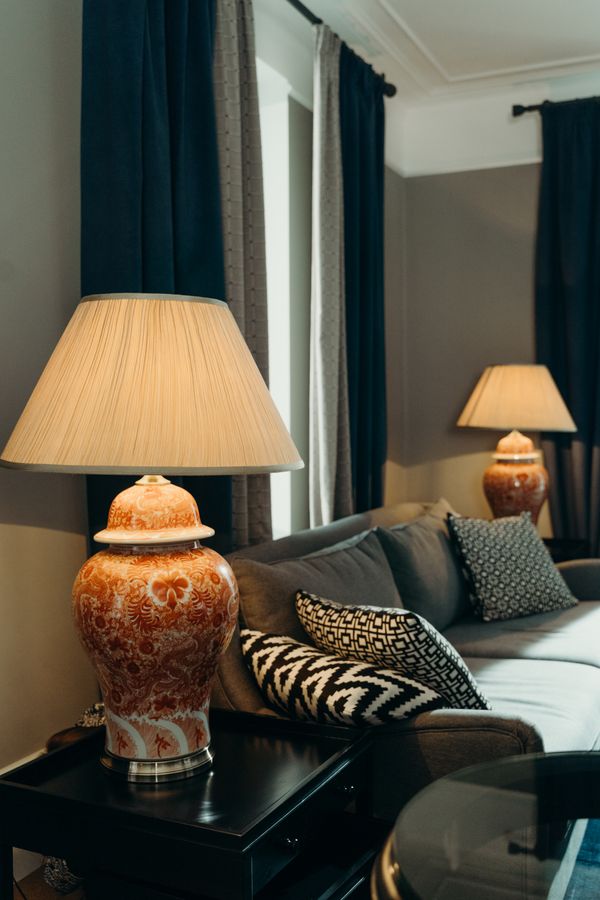 A table lamp with a ceramic base in a living room